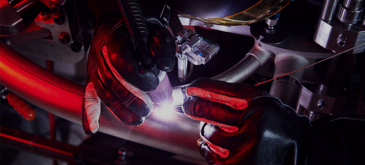 welder working on brompton bike frame