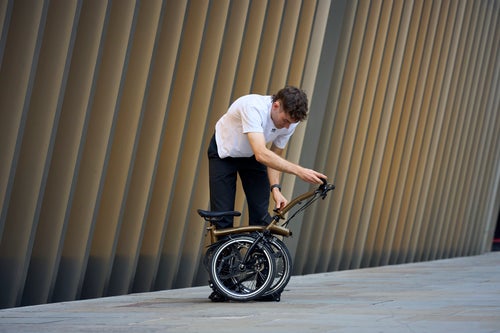person unfolding a brompton p line