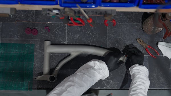 Person working on Brompton bike frame