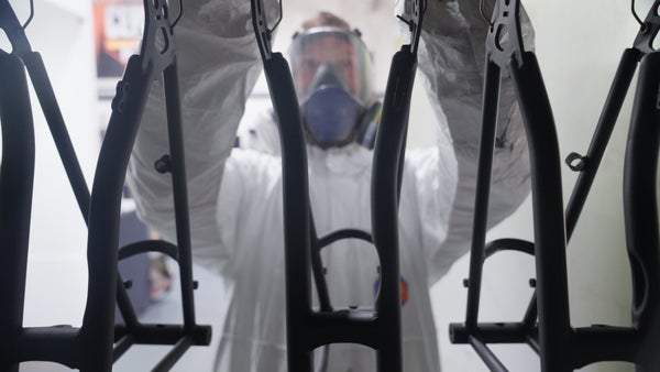Person working on Brompton bike frames