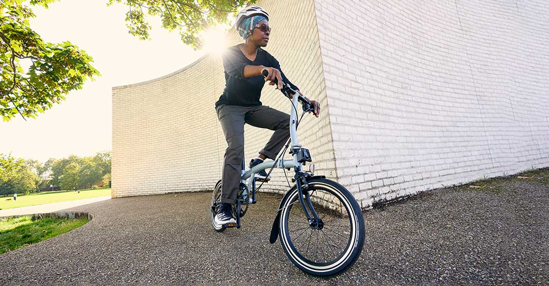 Woman riding Brompton