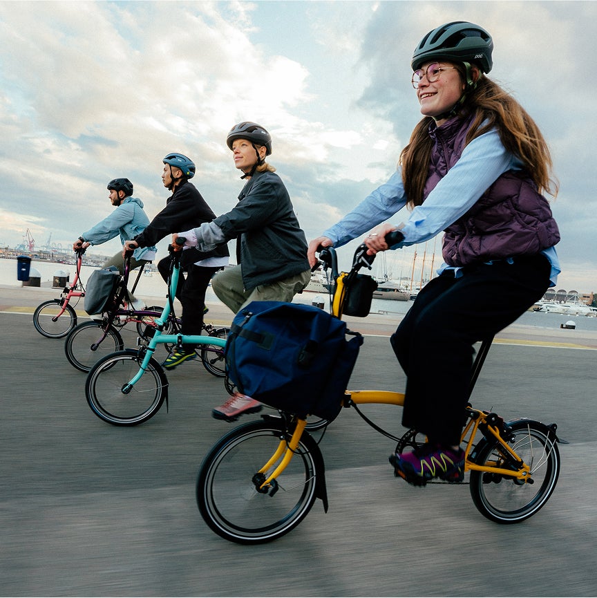 People riding Brompton bikes