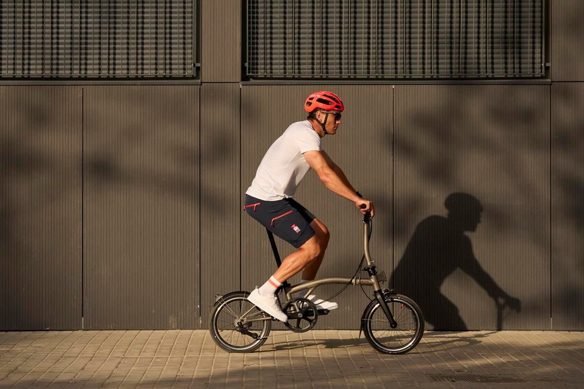 Ben Cornish cycling on a Brompton folding bike for the INEOS partnership