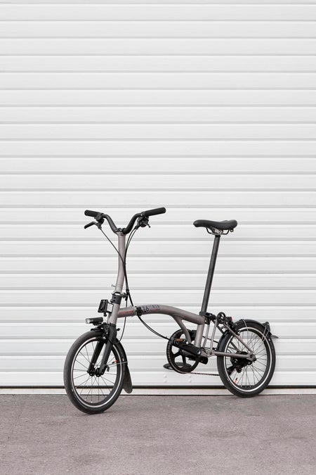 ineos britannia t line brompton bike in front of a white background