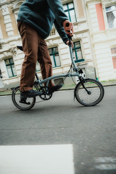 A bird-eye view of a person riding a P Line on concrete